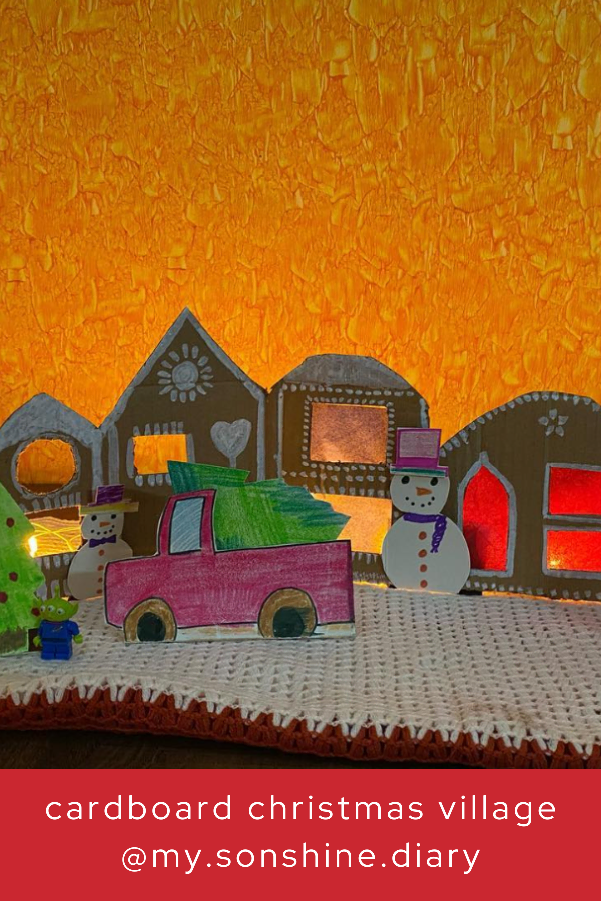 Add a pop of color to your Christmas village with this playful display! Featuring vibrant cardboard houses, a snowman, and even a little Christmas truck, this craft lets your imagination run wild.